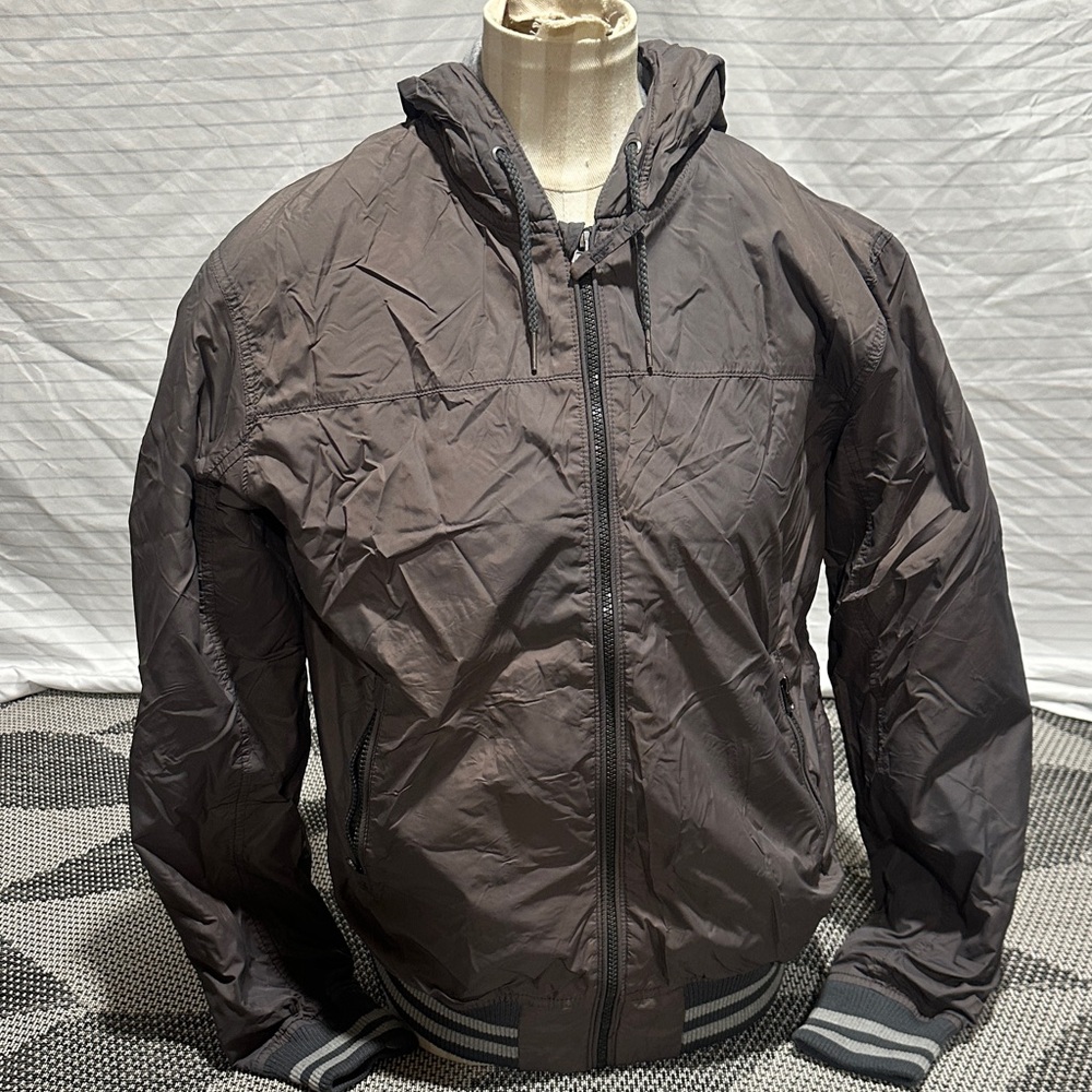 H&M L.O.G.G. vintage nylon hooded baseball jacket in a dark gray color